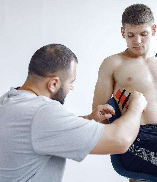 Physiotherapist helping a young patient